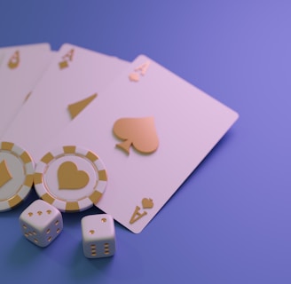 A set of playing cards displaying four aces is laid out on a surface. Alongside them, there are two poker chips with heart and diamond symbols, and three six-sided dice showing different numbers. The background is a smooth gradient of purple, creating a thematic gaming or casino atmosphere.